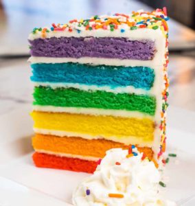 Cake Bosses Rainbow Cake on a plate
