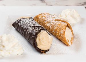Chocolate Shell and Regular cannolis on a plate